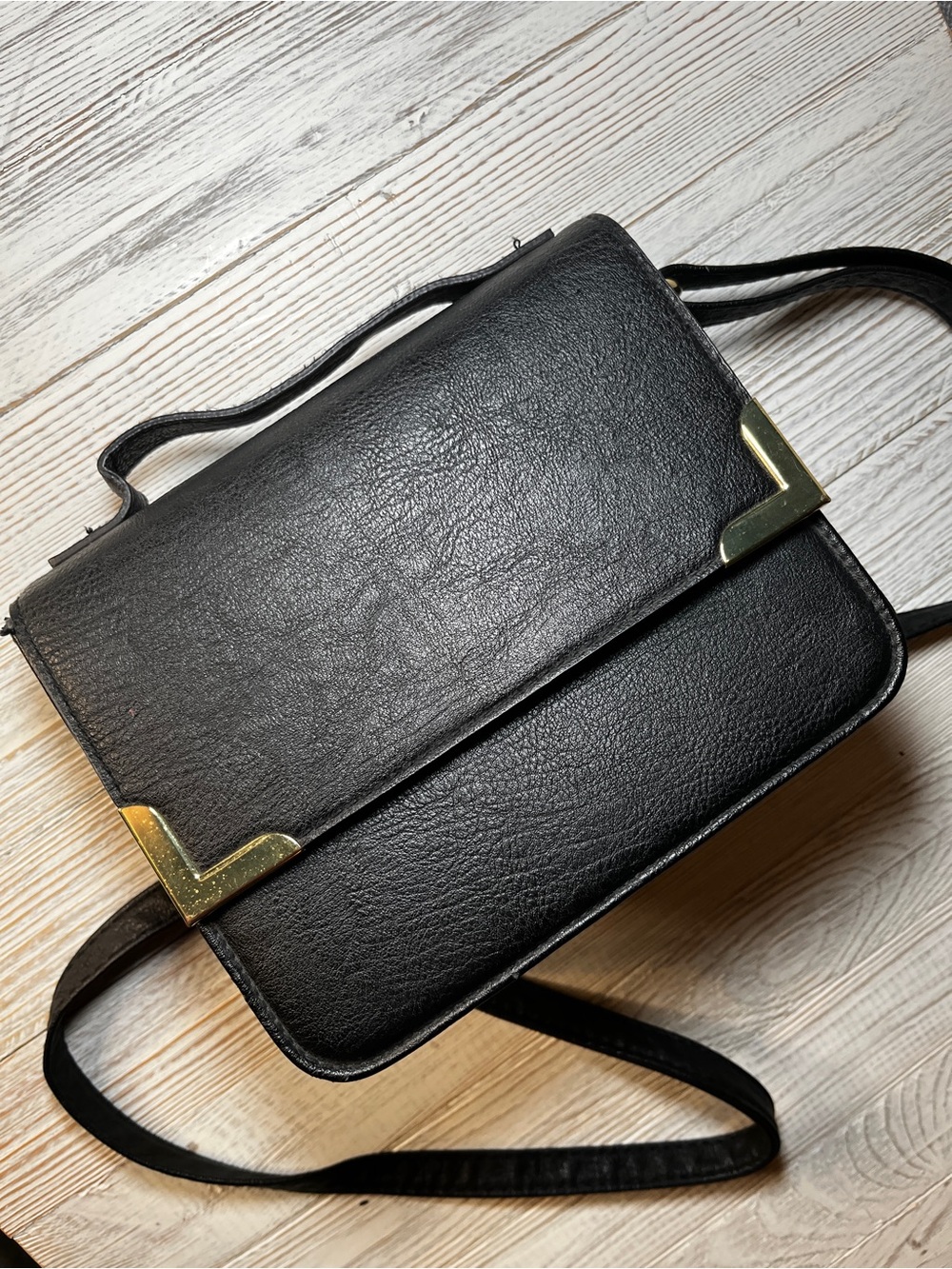 Structured Black Crossbody Bag with Gold Accents